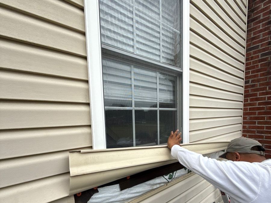 Crew installing lap siding
